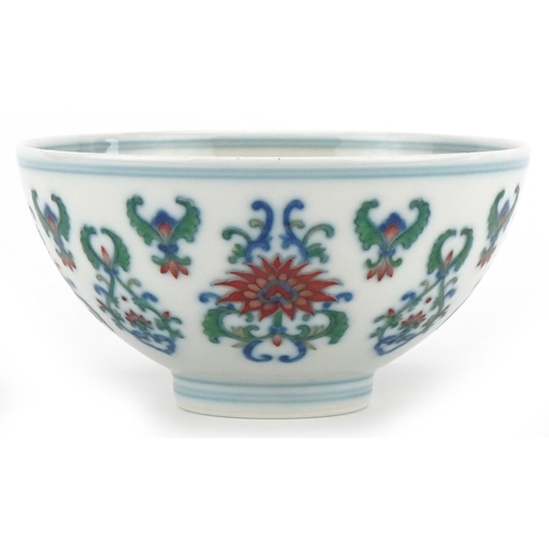 187 - A 20th century Chinese porcelain footed bowl hand painted with stylized flowers, six figure characte... 