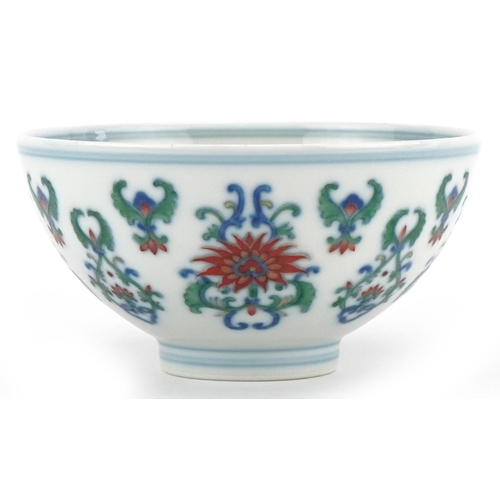 187 - A 20th century Chinese porcelain footed bowl hand painted with stylized flowers, six figure characte... 