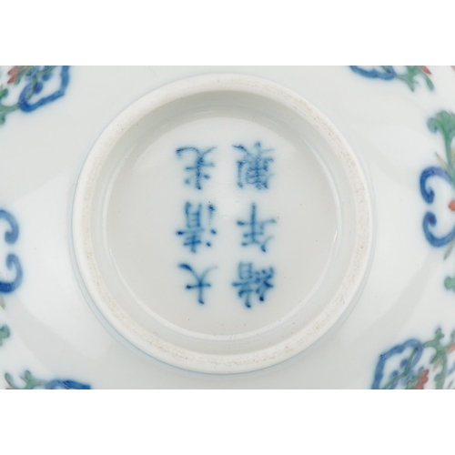 187 - A 20th century Chinese porcelain footed bowl hand painted with stylized flowers, six figure characte... 