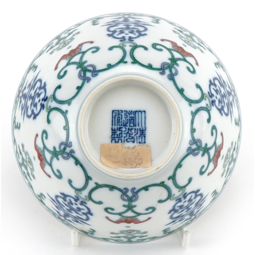 313 - A 20th century Chinese porcelain footed bowl hand painted with bats and stylized motifs, character m... 