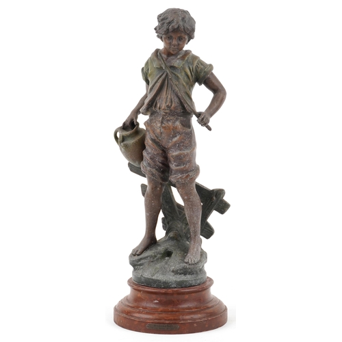 488 - After R F Moreau, a spelter study of a young boy with water jug raised on a turned wooden base, 46cm... 