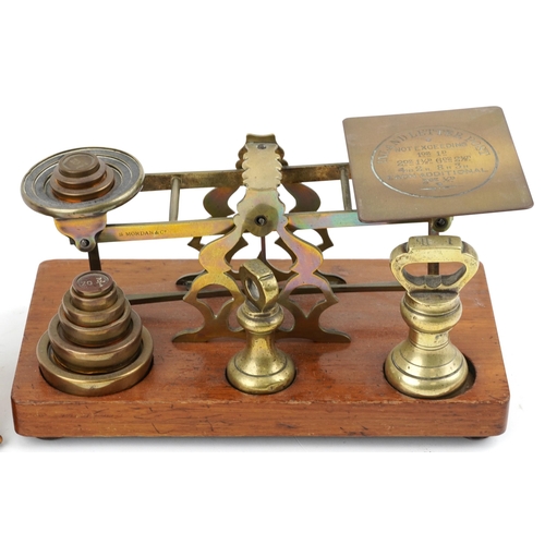 1589 - A set of Victorian brass post scales by S Mordan & Co. and an Edwardian open brass letter rack, the ... 