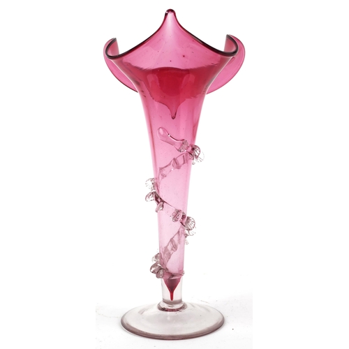 260 - A Victorian cranberry glass tulip vase with trailed decoration, 27cm high.