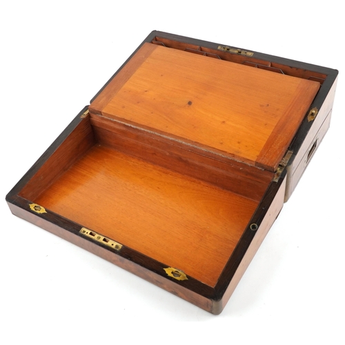  A 19th century figured walnut writing slope with fitted interior and brass fittings, 45cm wide.