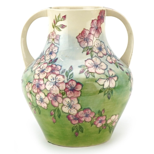  A large Moorcroft Spring Blossom patterned twin handled vase by Jennifer James, 26cm high.