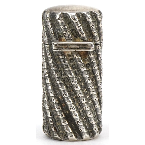  Sampson Mordan & Co., a Victorian silver cased scent bottle with hinged lid and writhen body, London... 