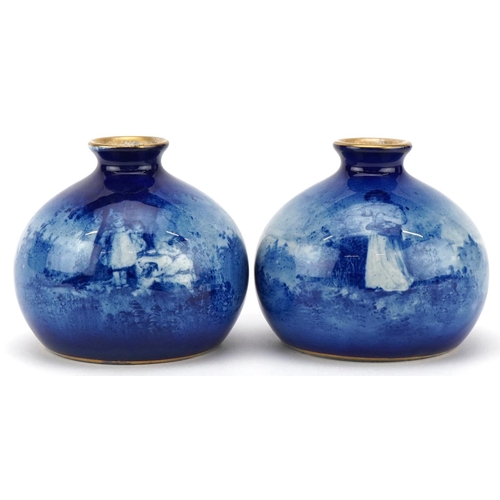 54 - A pair of Royal Doulton Blue Children series ware bulbous vases, 8cm high.