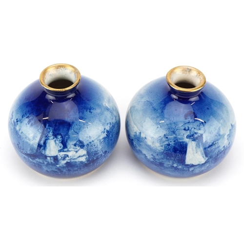 54 - A pair of Royal Doulton Blue Children series ware bulbous vases, 8cm high.