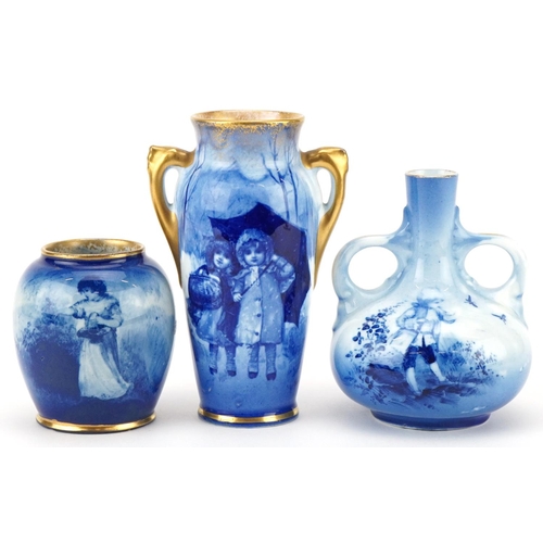 Three Royal Doulton Blue Children series ware vases, the largest 11.5cm high.