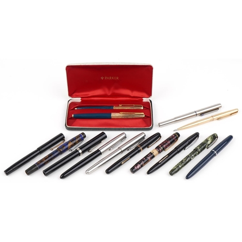 308 - Vintage and later fountain pens and ballpoint pens, some with gold nibs, including Parker, Conway St... 