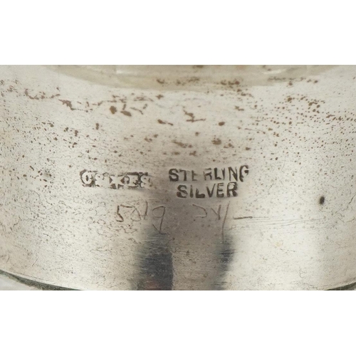 628 - An Art Deco glass atomiser with sterling silver and green guilloche enamel lid, 13cm high.