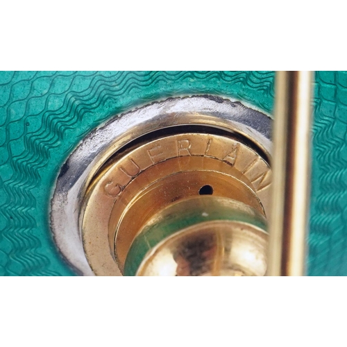 628 - An Art Deco glass atomiser with sterling silver and green guilloche enamel lid, 13cm high.