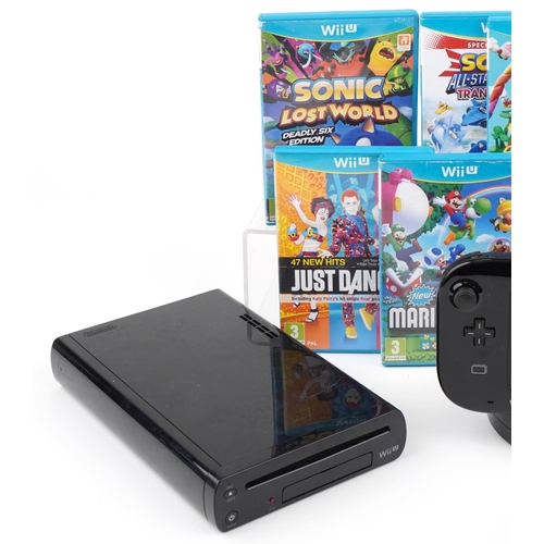 1128 - A Nintendo Wii U games console with accessories and a collection of games including Mario & Sonic at... 