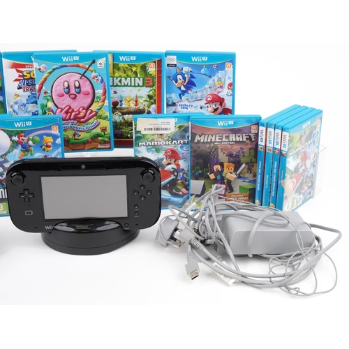 1128 - A Nintendo Wii U games console with accessories and a collection of games including Mario & Sonic at... 