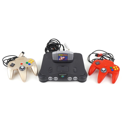 1127 - A Nintendo 64 games console with controllers and Yoshi's Story game.