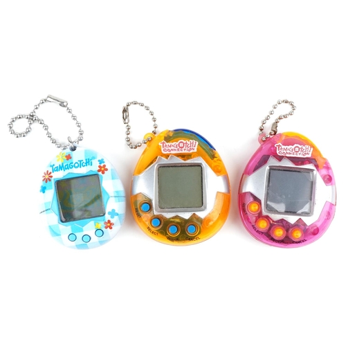 Three vintage Tamagotchis including two Tamagotchi Connections.