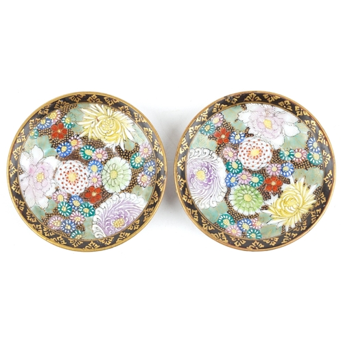 532 - A pair of small Japanese Satsuma earthenware dishes, 20th century, each with floral enamelled decora... 