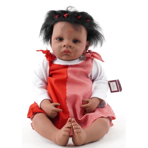 1162 - An Ashton-Drake Galleries 'Jasmine Goes to Grandmas' doll, circa 2004, 52cm in length, boxed.