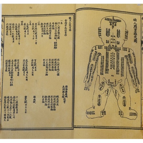 1114 - Twelve antique style paper books of Chinese script.