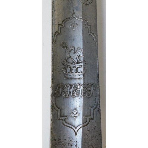 2508 - A British military Henry Wilkinson steel bladed sword with scabbard, 100cm in length.