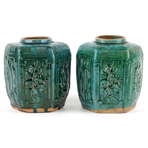 2599 - A pair of Chinese hexagonal green glazed terracotta vases, 20th century, each moulded in relief with... 