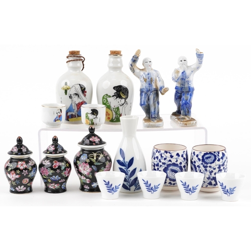 1642 - A small group of mixed Chinese porcelain items, 20th century, including a pair of sake decanters and... 