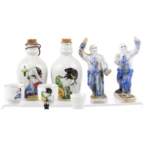 1642 - A small group of mixed Chinese porcelain items, 20th century, including a pair of sake decanters and... 