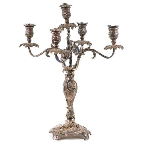 265 - An early 20th century plated candelabra with scrollwork decoration, raised on a pierced base, 48cm h... 