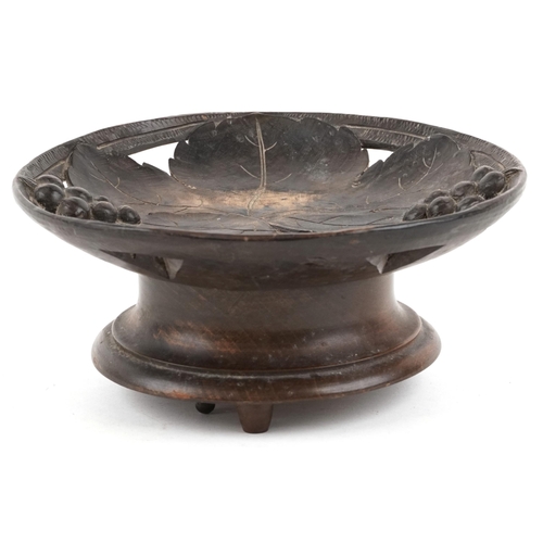 67 - An early 20th century Swiss Black Forest carved beech musical centrepiece bowl carved with grapes an... 