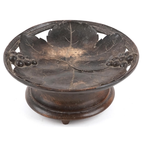 67 - An early 20th century Swiss Black Forest carved beech musical centrepiece bowl carved with grapes an... 