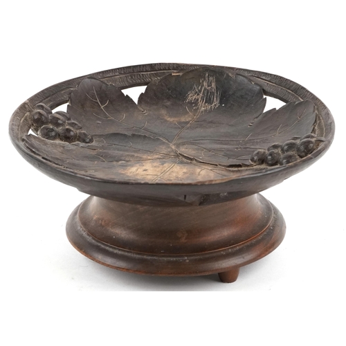 67 - An early 20th century Swiss Black Forest carved beech musical centrepiece bowl carved with grapes an... 