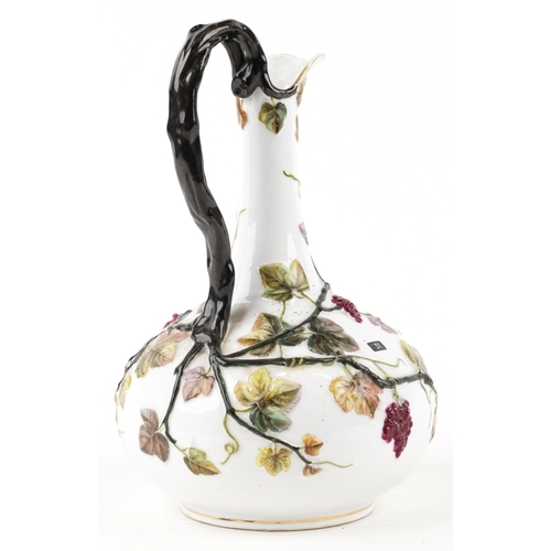 135 - An early 20th century continental porcelain pitcher with hand painted floral decoration, 31cm high.