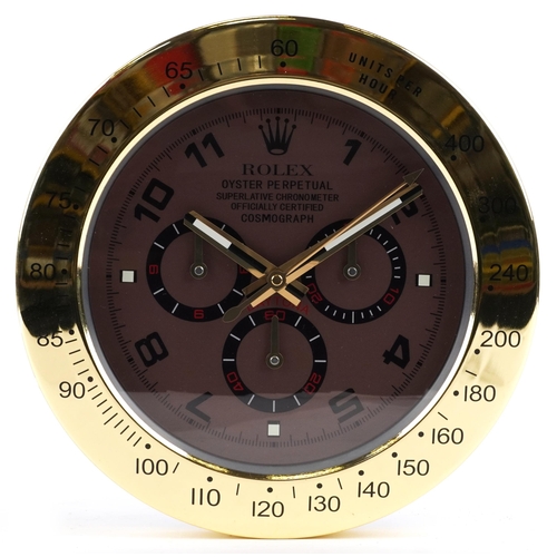 2595 - A Rolex Daytona design dealer's display wall clock, 34cm in diameter.