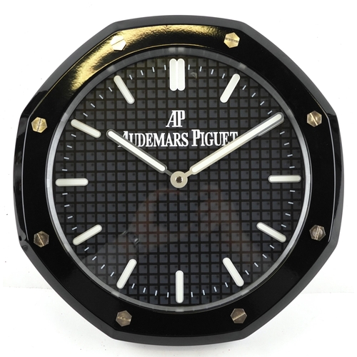 1594 - An Audemars Piguet design dealer's display wall clock, 34cm in diameter.