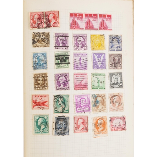 1329 - A red stamp album containing 19th century and later British and world stamps including China, France... 