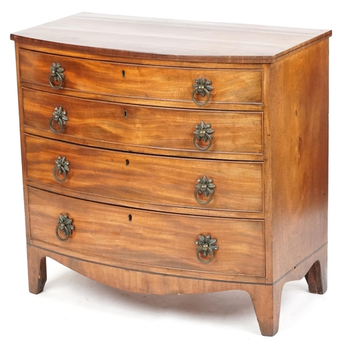 A late George III mahogany bow front chest of four graduated long drawers, on bracket feet, 80cm H x 88cm W x 49cm D.