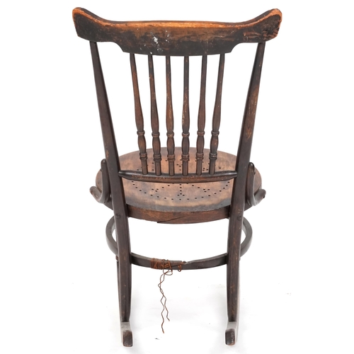 2187 - An early 20th century American carved beech rocking chair, 81cm high x 47cm wide.