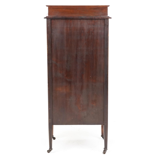 2101 - An Edwardian walnut music cabinet fitted with a glazed door, raised on square tapering legs, 118cm H... 