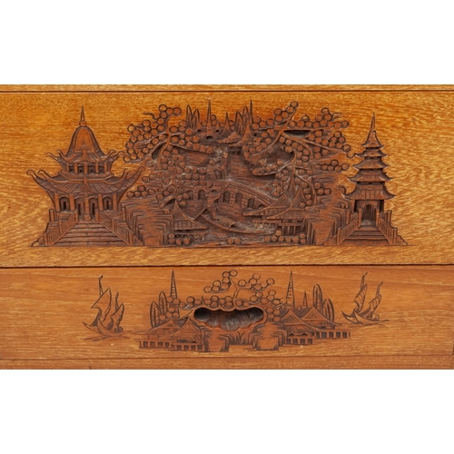  A Chinese teak side cabinet, early 20th century, with carved decoration, fitted with four drawers an... 