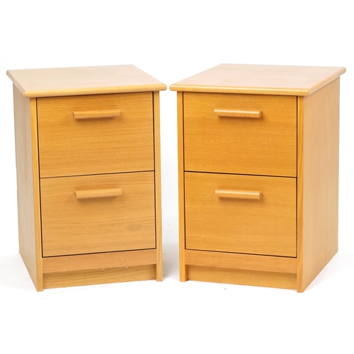 2112 - A pair of contemporary solid ash chests of two drawers, on plinth bases, 66cm H x 45cm W x 53cm D.