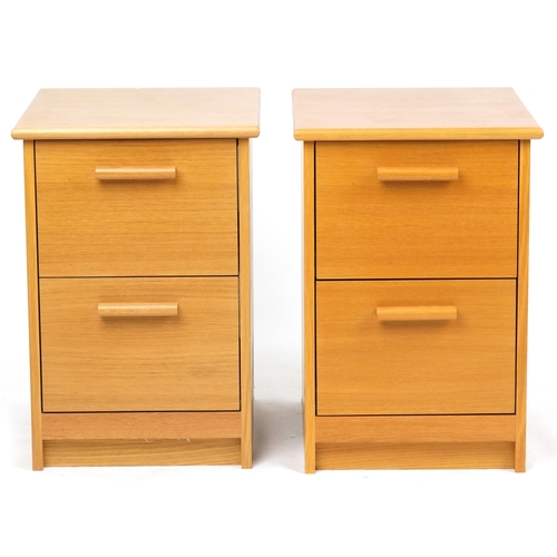 2112 - A pair of contemporary solid ash chests of two drawers, on plinth bases, 66cm H x 45cm W x 53cm D.