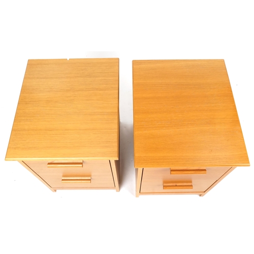 2112 - A pair of contemporary solid ash chests of two drawers, on plinth bases, 66cm H x 45cm W x 53cm D.