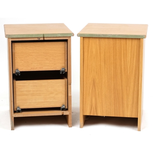 2112 - A pair of contemporary solid ash chests of two drawers, on plinth bases, 66cm H x 45cm W x 53cm D.