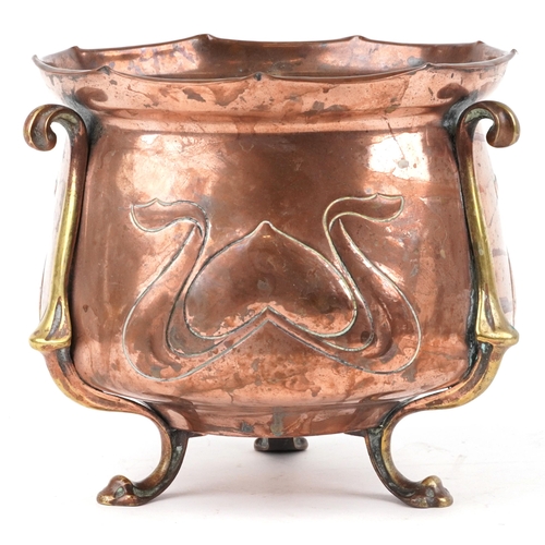 157 - An Arts & Crafts copper and brass jardinière embossed with stylized motifs by Soutter & Sons, 20cm h... 