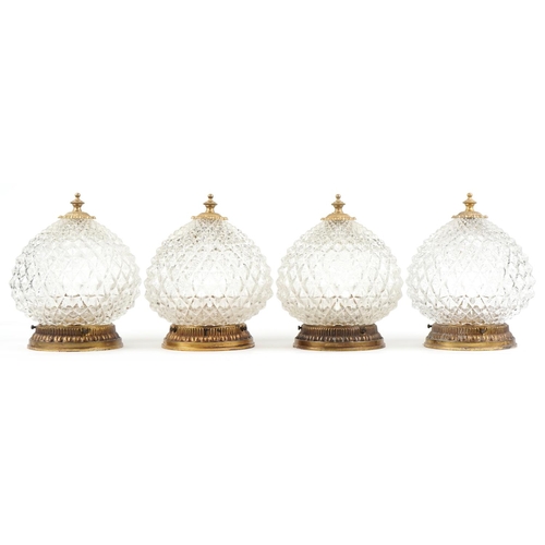 2584 - A set of four mid 20th century clear moulded glass globular ceiling lights with gilt metal mounts, 2... 