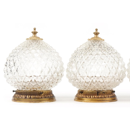 2584 - A set of four mid 20th century clear moulded glass globular ceiling lights with gilt metal mounts, 2... 