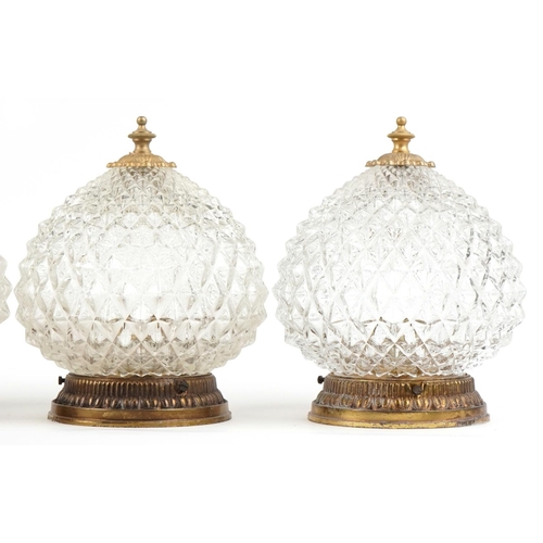 2584 - A set of four mid 20th century clear moulded glass globular ceiling lights with gilt metal mounts, 2... 