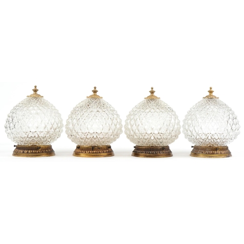 2584 - A set of four mid 20th century clear moulded glass globular ceiling lights with gilt metal mounts, 2... 