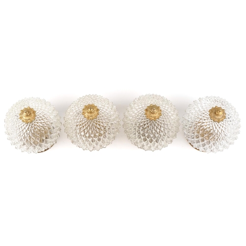 2584 - A set of four mid 20th century clear moulded glass globular ceiling lights with gilt metal mounts, 2... 