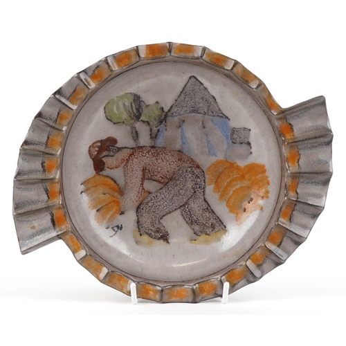 An Art Deco pottery bowl by Michael Andersen, Denmark, circa 1930, decorated with a farmer with a stylized ribbed rim, signed, bearing paper label to base, M.A & S., 28cm in diameter.